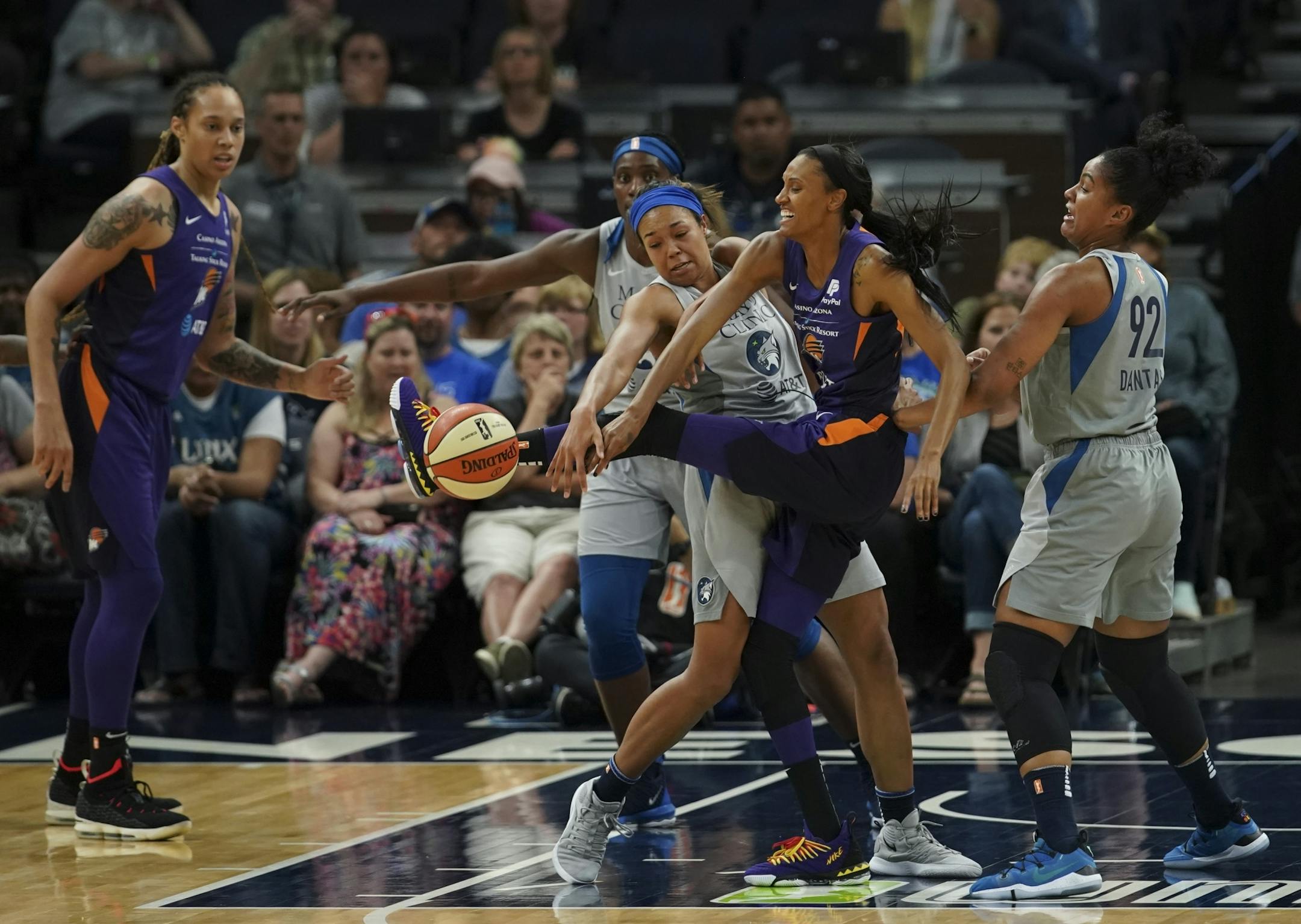 The defense of Minnesota Lynx forward Napheesa Collier forced Phoenix Mercury forward DeWanna Bonner (24) to lose control of the ball in the first quarter.