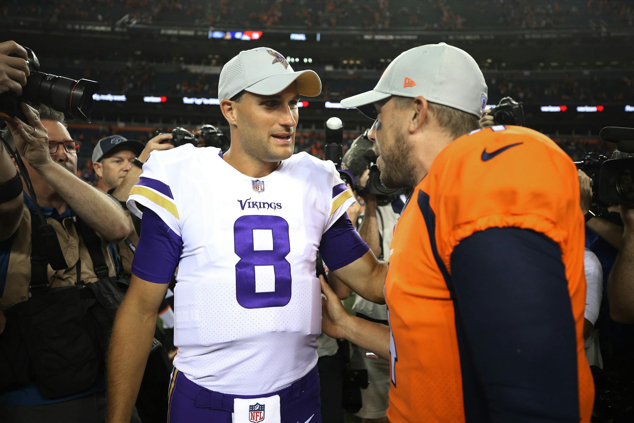 Kirk Cousins and Case Keenum chatted after a Vikings-Broncos preseason game in 2018. Keenum has since moved on to be the starting quarterback for the Washington Redskins, the Vikings' opponent Thursday at U.S. Bank Stadium.