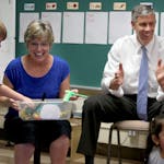 Education Secretary Arne Duncan, right, got to join Jody Bohrer's Kindersprouts circle time during his Minnesota visit along with students Brody Mallu
