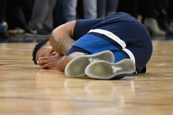 Wolves point guard Jeff Teague fell to the ground in pain after injuring his left knee late in the fourth quarter against the Denver Nuggets on Wednes