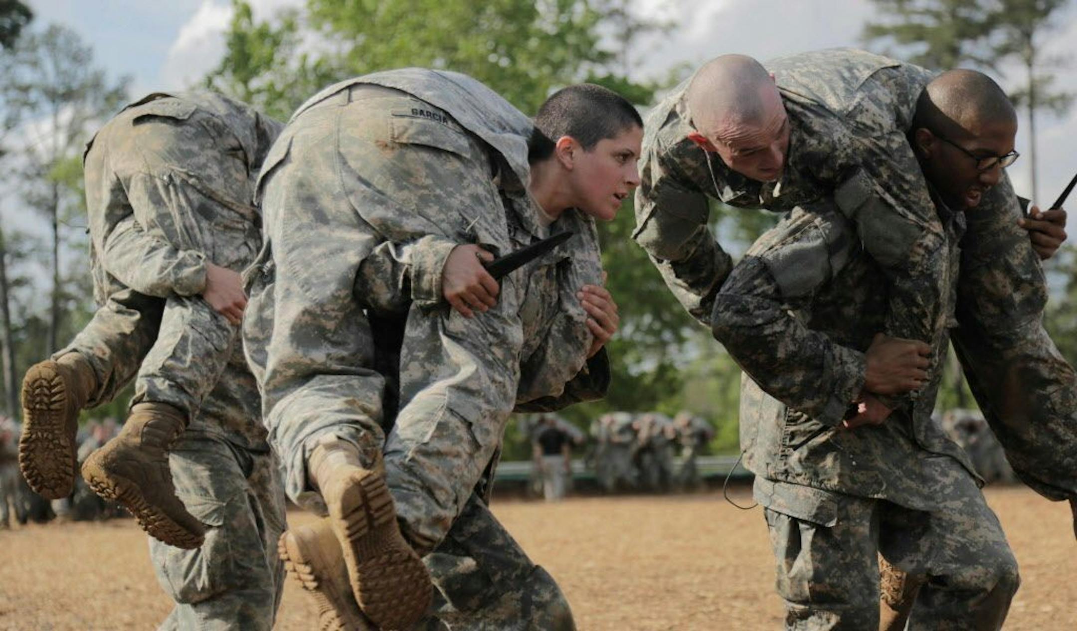 In a handout photo provided by the U.S. Army, Capt. Kristen Griest, center, participates in combatives training during the Ranger Course at Ft. Benning, Ga., April 20, 2015. When Griest and an anther woman, 1st. Lt. Shaye Haver, graduate from the school on Friday, they may put to rest, in the minds of many people, lingering questions about whether women can serve as combat officers and lead troops into battle. (Spc. Nikayla Shodeen/U.S. Army via The New York Times) --EDITORIAL USE ONLY