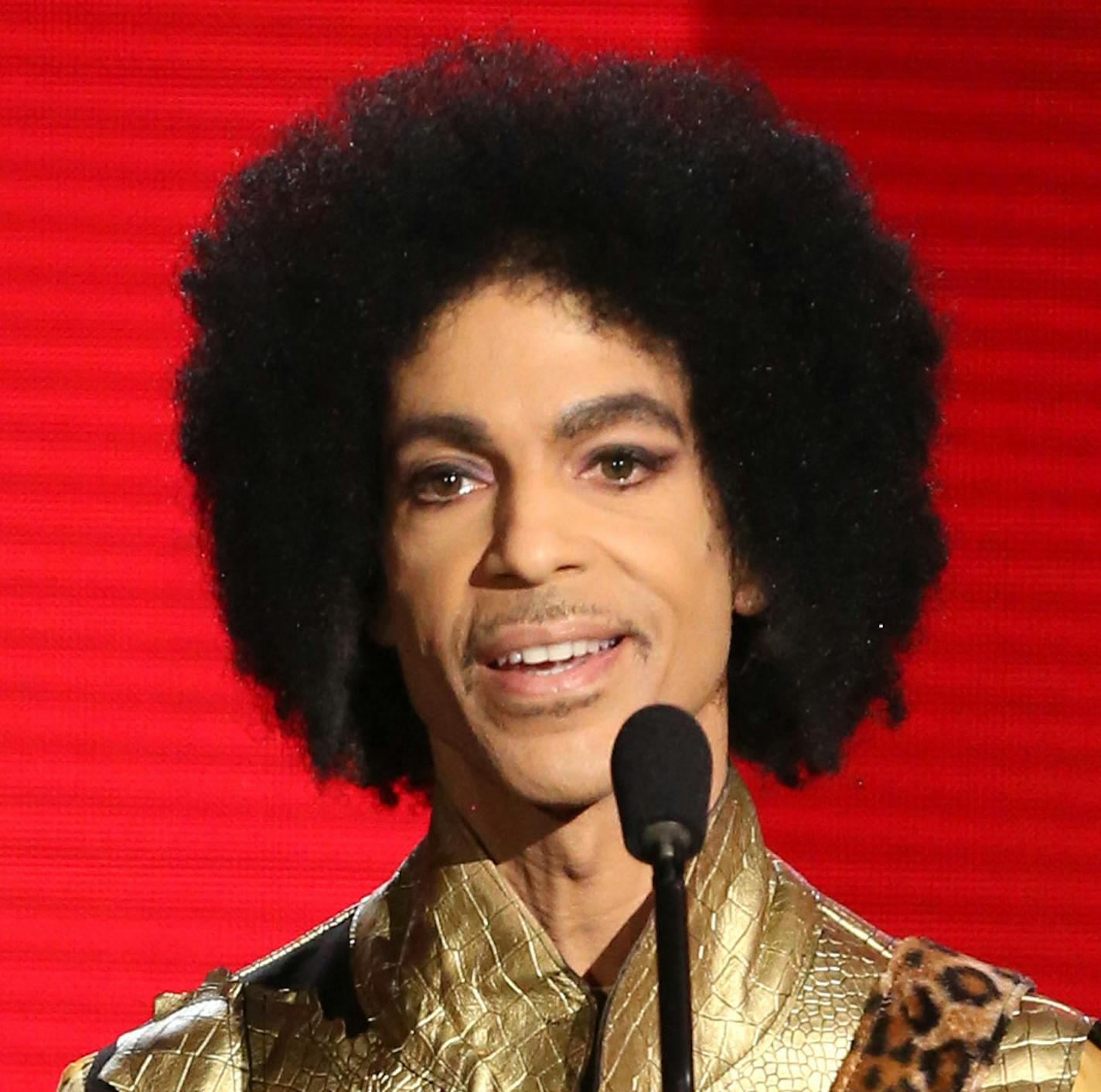 Prince presents the award for favorite album - soul/R&B at the American Music Awards at the Microsoft Theater on Sunday, Nov. 22, 2015, in Los Angeles. (Photo by Matt Sayles/Invision/AP)