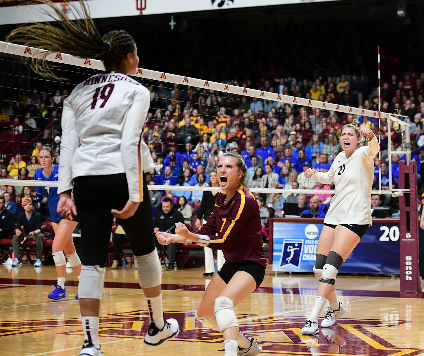 From left, Gophers outside hitter Alexis Hart (19), libero CC McGraw (7) and middle blocker Regan Pittman (21) celebrated a third set kill by Hart against Creighton.