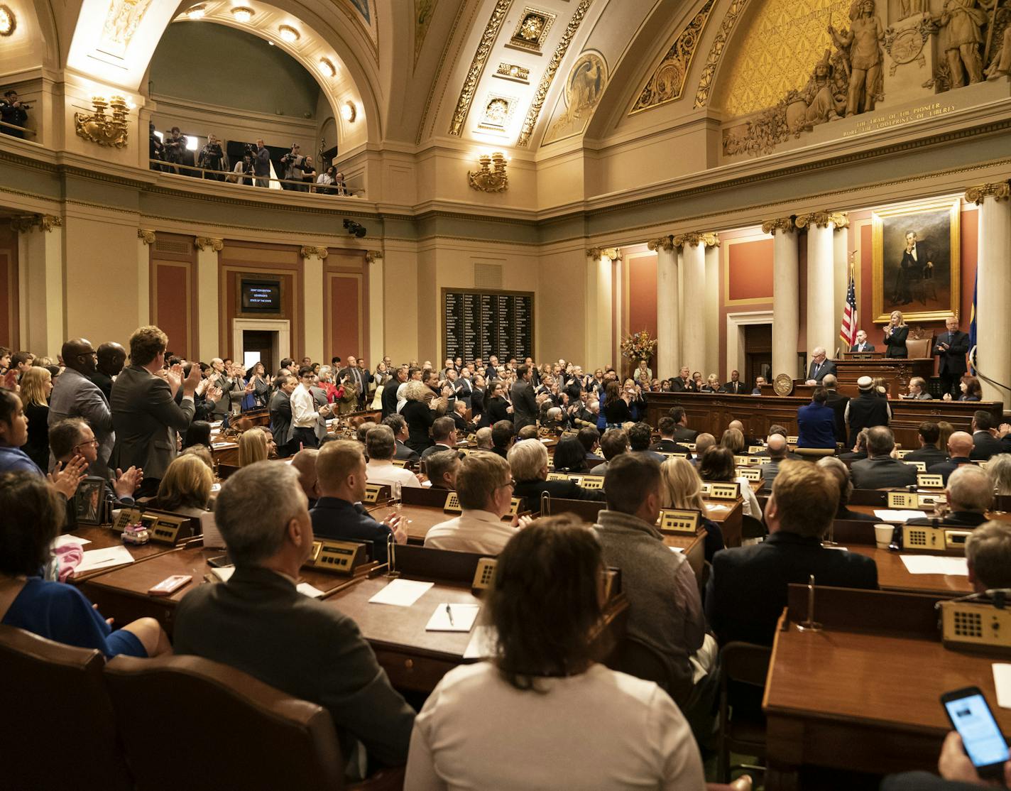 Democrats stood to applaud a statement by Gov. Tim Walz as Republicans stayed in their seats during the State of the State Address at the State Capitol in St. Paul, Minn., on Wednesday, April 3, 2019. ] RENEE JONES SCHNEIDER &#xa5; renee.jones@startribune.com