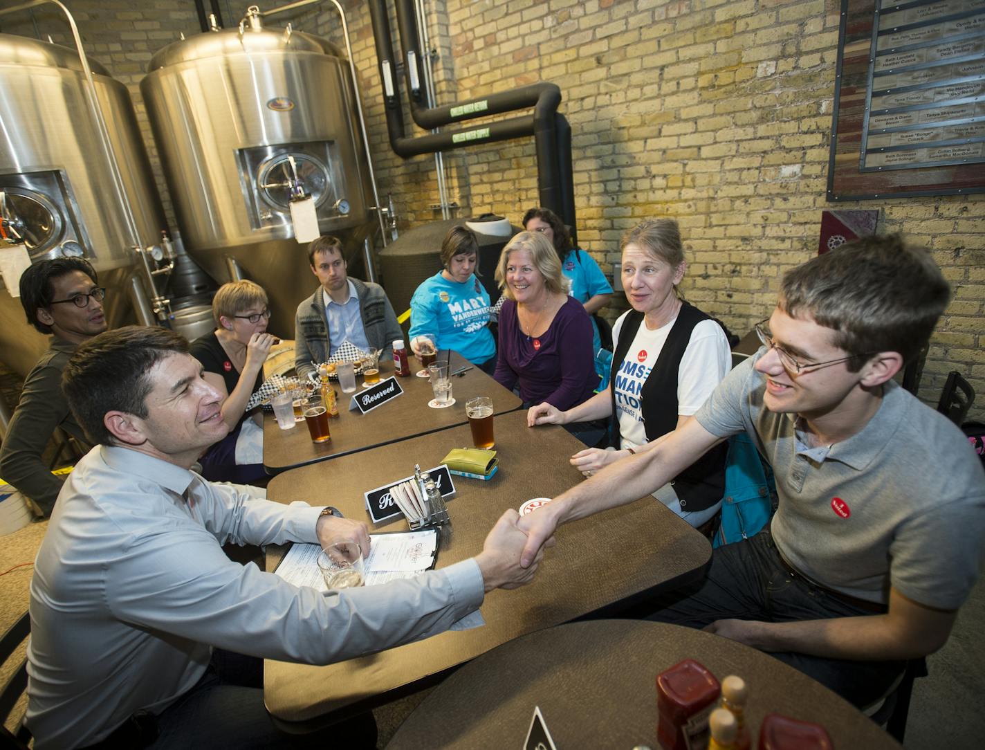 St. Paul Ward 4 City Council incumbent Russ Stark. left, shook hands with supporter Karl Carter at Tuesday night's DFL election party at Urban Growler. ] (AARON LAVINSKY/STAR TRIBUNE) aaron.lavinsky@startribune.com All seven of St. Paul's City Council seats are up for election, including two open wards where incumbents didn't run again. As many as three who have challenged Mayor Chris Coleman's goals and strategies have a chance of winning.The DFL held an election party at Urban Growler on Tuesd