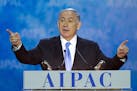 Israeli Prime Minister Benjamin Netanyahu gestures while speaking at the 2015 American Israel Public Affairs Committee (AIPAC) Policy Conference in Wa