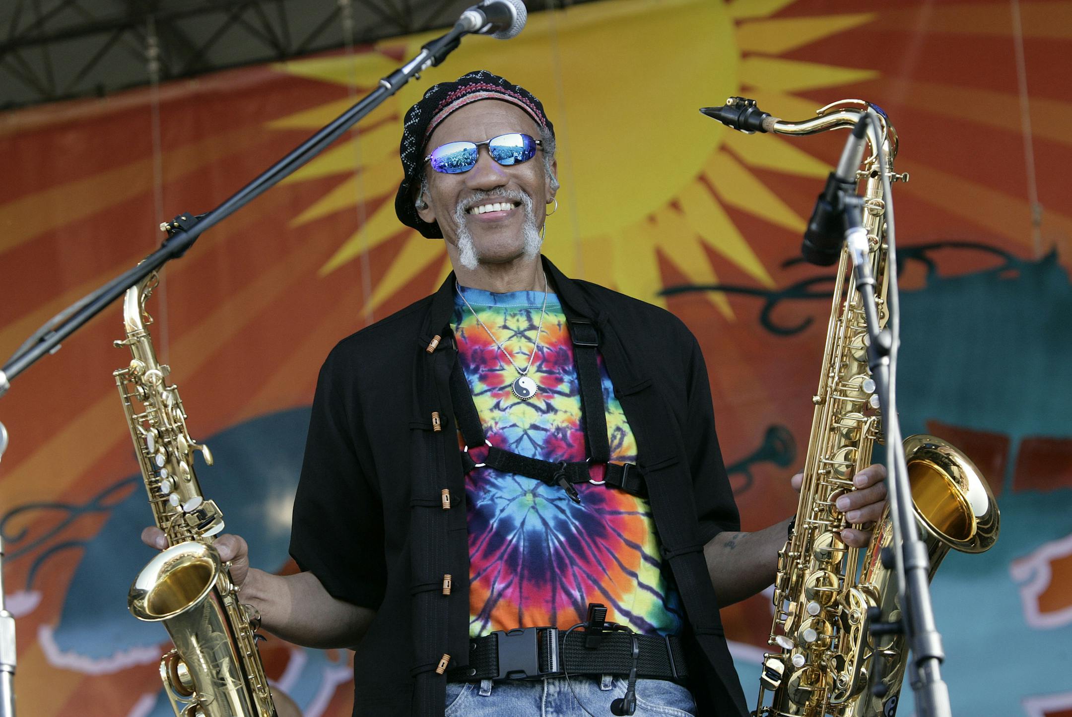 FILE - In a May 4, 2008 file photo, Charles Neville arrives with The Neville Brothers on stage to perform during the 2008 New Orleans Jazz & Heritage Festival at the New Orleans Fairgrounds Racetrack in New Orleans. New Orleans-born saxophone player Charles Neville has died at age 79. A publicist for Aaron Neville’s management agency confirmed the death in an email. (AP Photo/Dave Martin, File)
