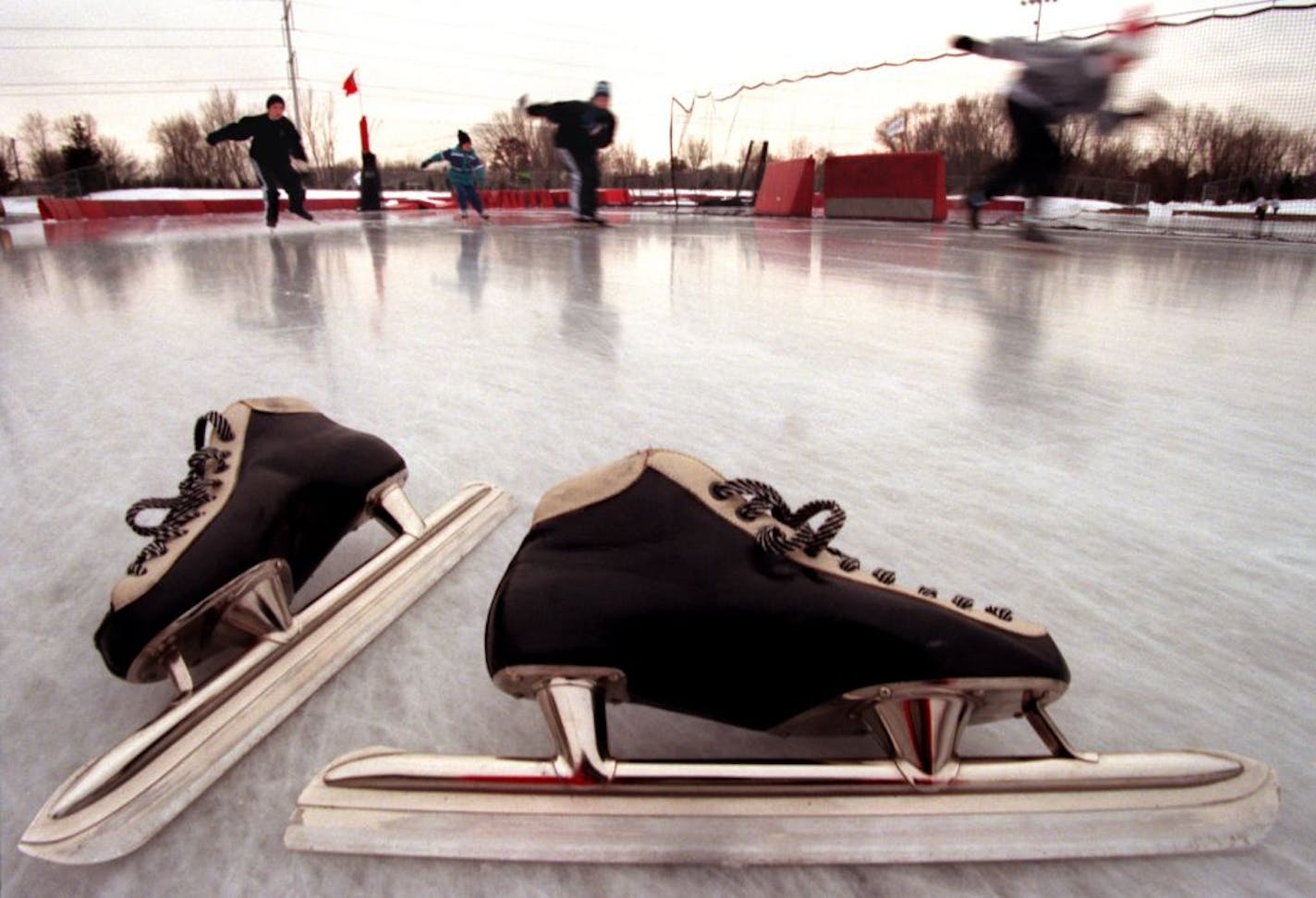 Long blade ice skating at The Oval in Roseville -- A pair of long blade skates on the ice at The Oval in Roseville.