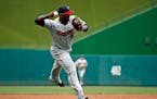 Minnesota Twins third baseman Miguel Sano throws to first base for the out on Washington Nationals' Anthony Rendon during the third inning of an inter