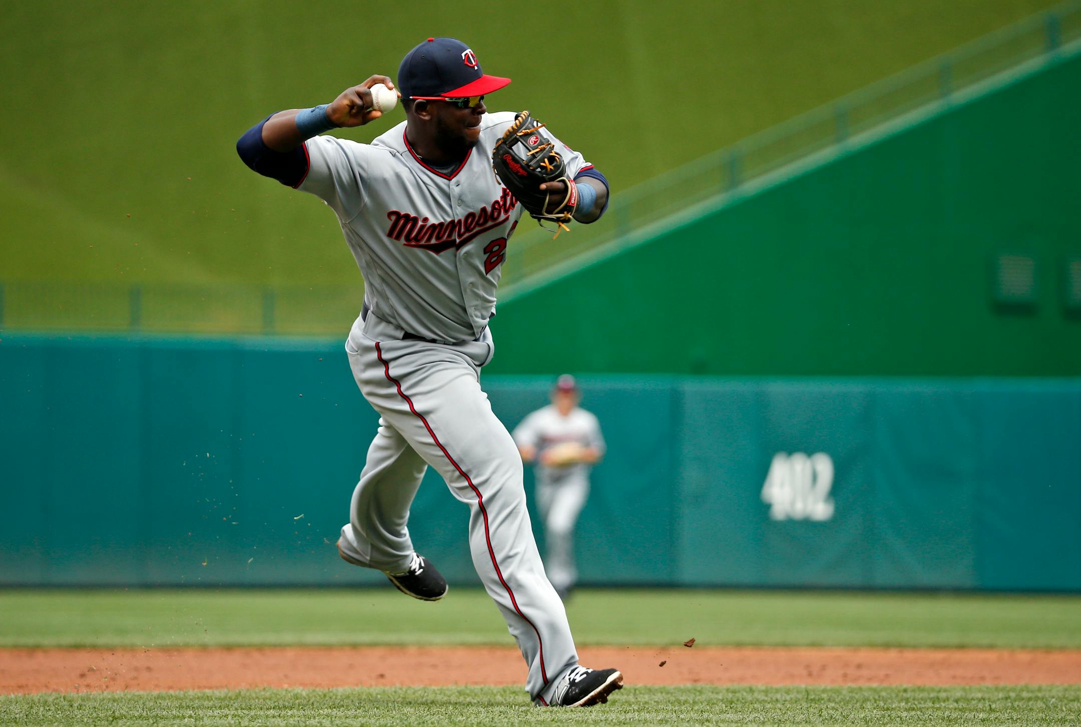 Minnesota Twins third baseman Miguel Sano throws to first base for the out on Washington Nationals' Anthony Rendon during the third inning of an interleague baseball game at Nationals Park, Saturday, April 23, 2016, in Washington. (AP Photo/Alex Brandon)