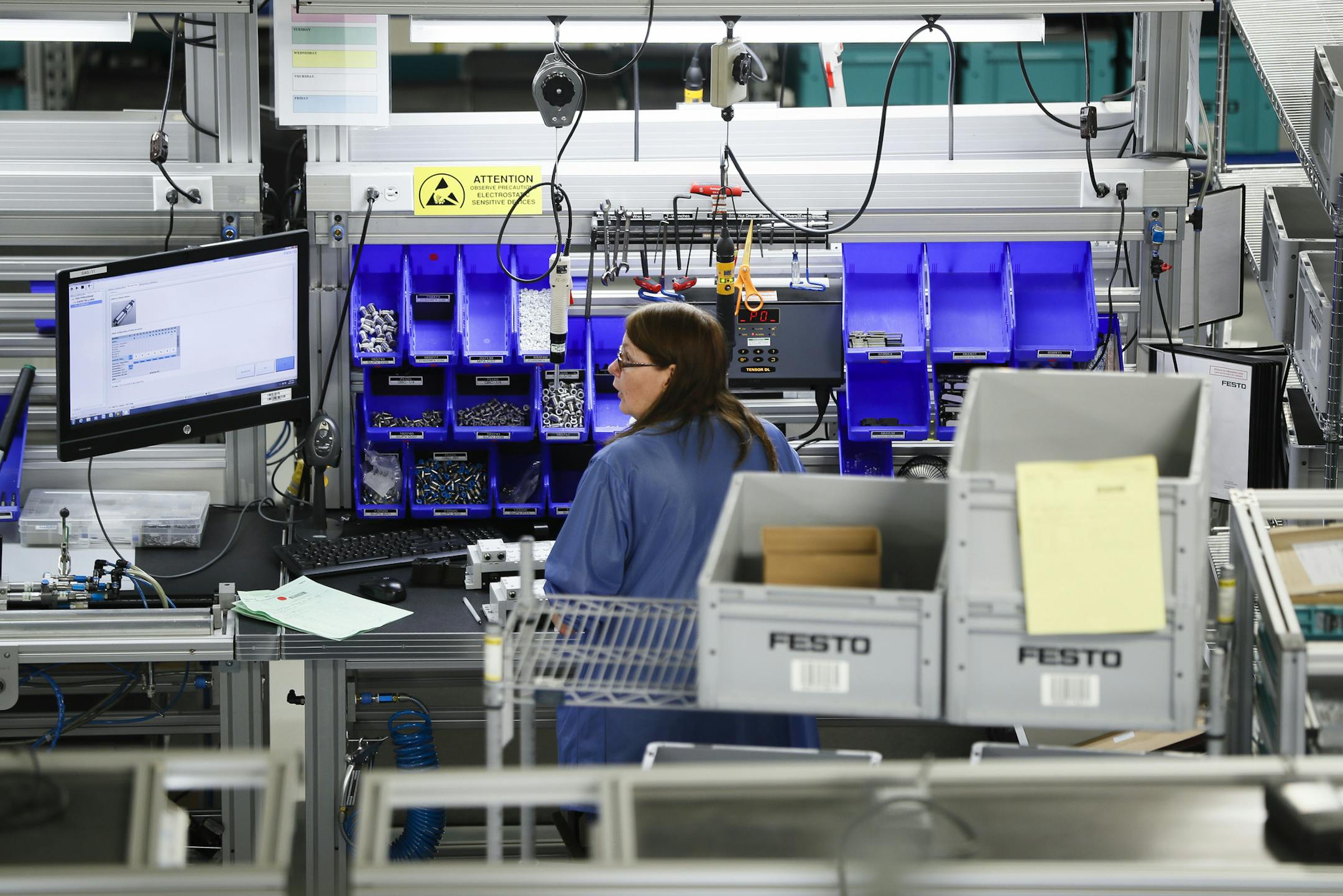 Manufacturing reports for November shows a slight slowdown both nationally and in Minnesota. Shown is the Festo distribution center in Mason, Ohio. (AP File Photo/John Minchillo)