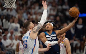 Timberwolves guard Terrence Shannon Jr. shoots around Oklahoma City center Isaiah Hartenstein (55) in Saturday night's game at Target Center.