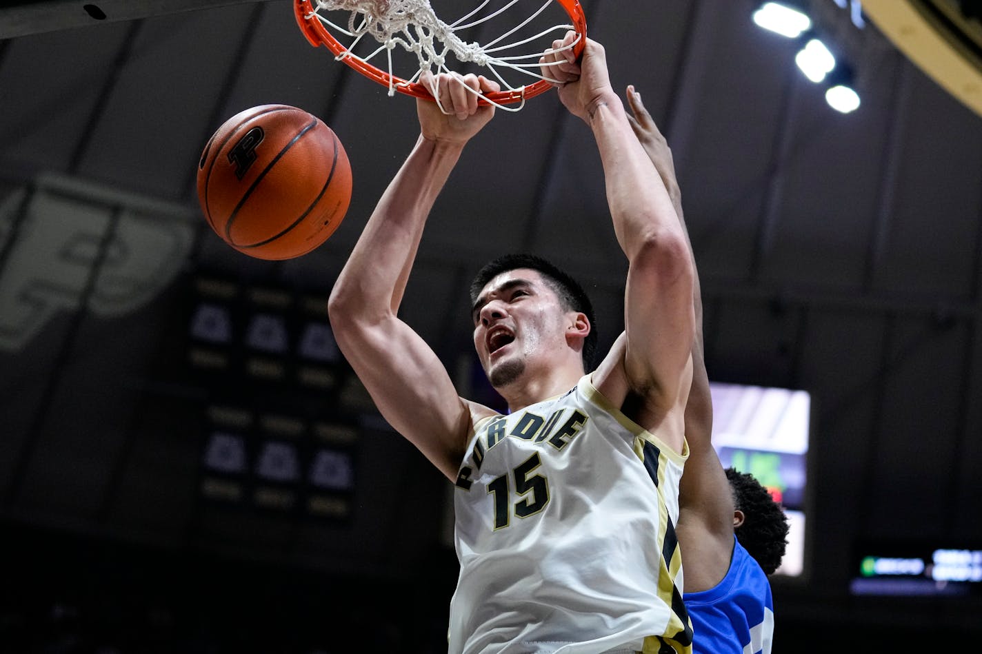 Purdue center Zach Edey (15) gets dunk in front of Hofstra forward Warren Williams (0) during the second half of an NCAA college basketball game in West Lafayette, Ind., Wednesday, Dec. 7, 2022. (AP Photo/Michael Conroy)