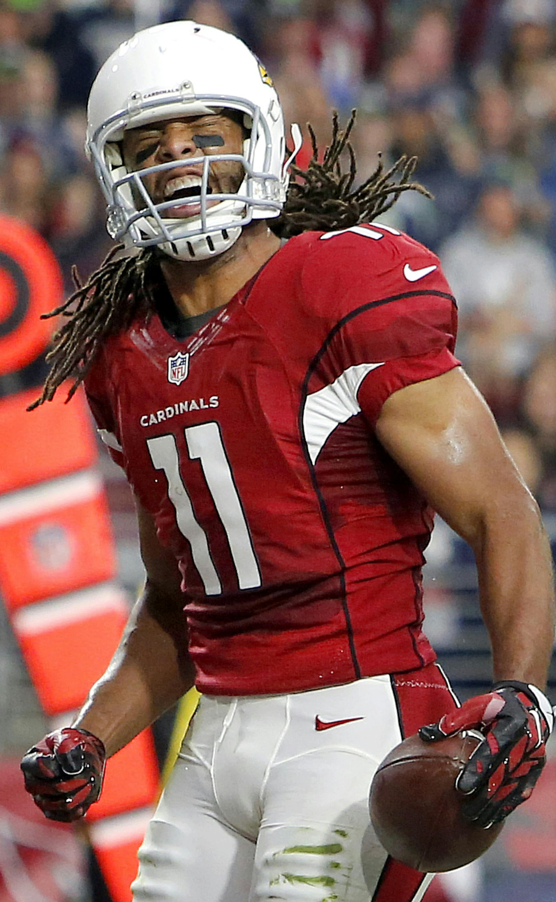 Arizona Cardinals wide receiver Larry Fitzgerald (11) celebrates his touchdown against the Seattle Seahawks during the first half of an NFL football game, Sunday, Jan. 3, 2016, in Glendale, Ariz. (AP Photo/Rick Scuteri) ORG XMIT: AZMY117