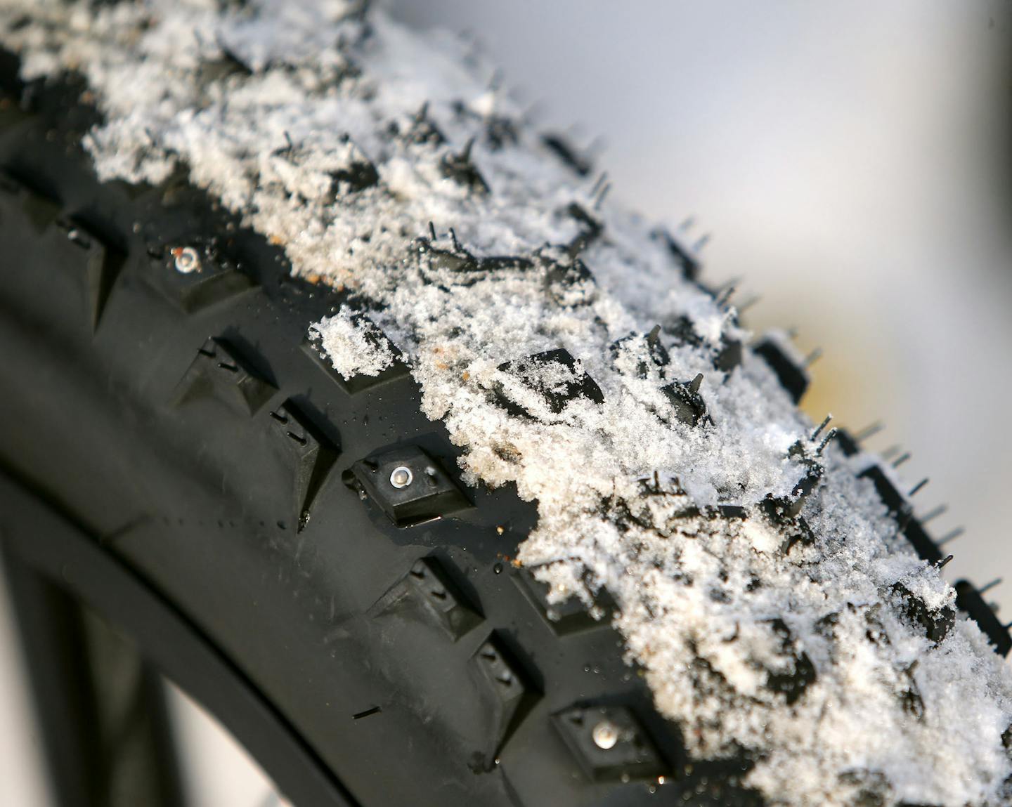 A close-up of the tread on the typical tire for fatbikes. Averaging 4 to 5 inches wide, these specialized tires give riders extra grip on snow and ice. Some fat tires even have metal studs for optimal traction.