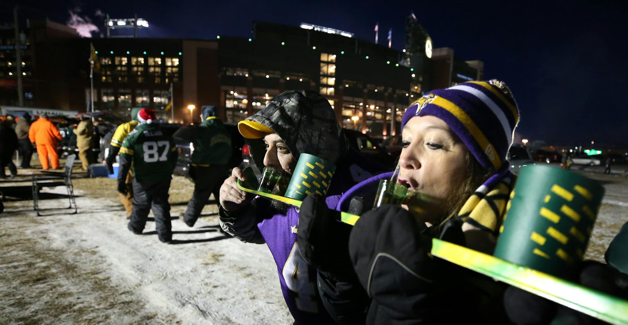 Vikings fans Steve Schueller and Tammy Schueller of Andover, MN drank shots from a ski at before the Vikings and Packers 7:30 kick off at Lambeau Field Saturday December 23, 2017 in Green Bay, WI.] JERRY HOLT ï jerry.holt@startribune.com