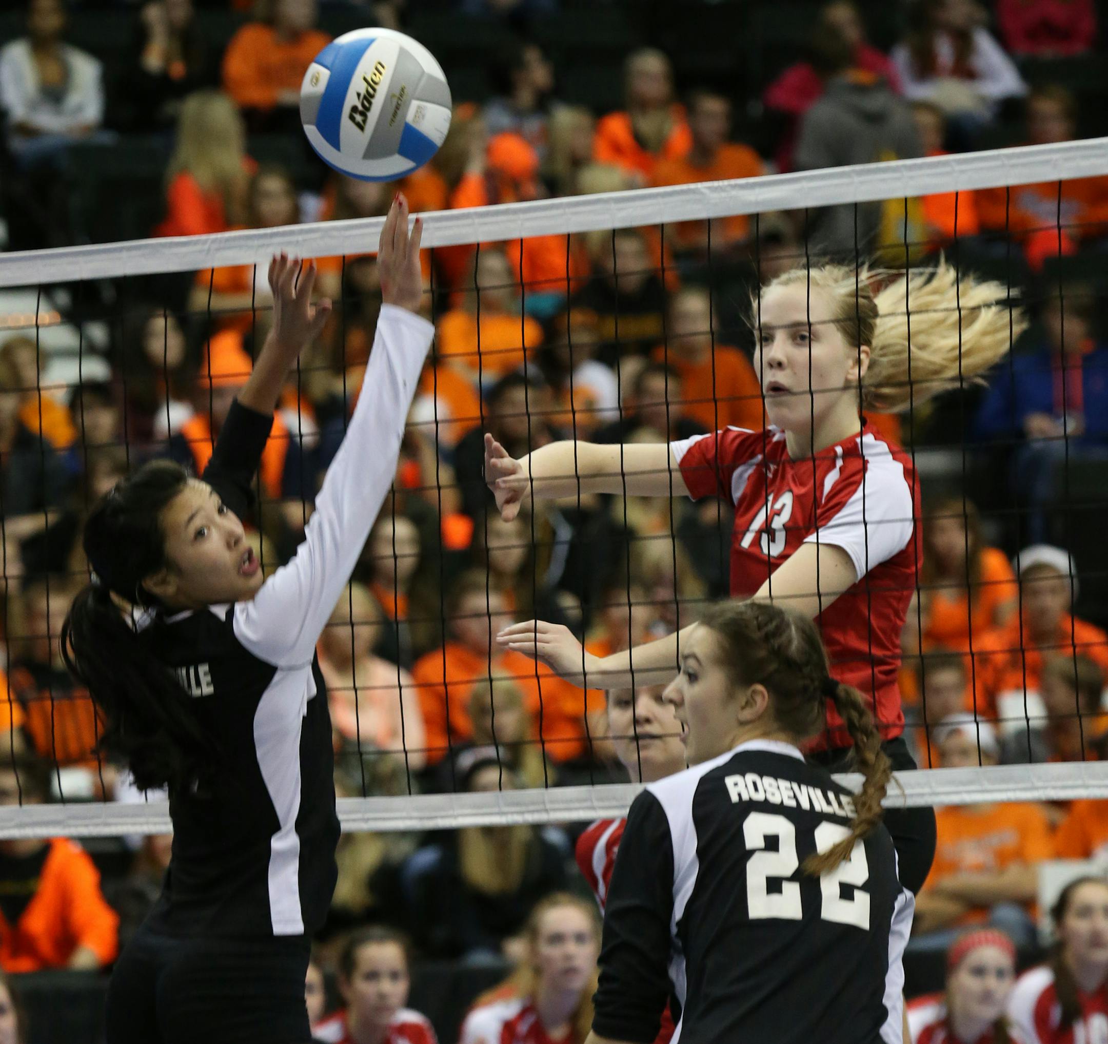 Minnesota State High School League Girls Volleyball State Tournament, 11/7/13, Xcel Energy Center. Class 3A state volleyball quarterfinals, Eden Prairie vs. Roseville. (right) Eden Prairie's Abby Aulora Campbell split the Roseville defensed with a spike.] Bruce Bisping/Star Tribune bbisping@startribune.com Aulora Campbell/roster.