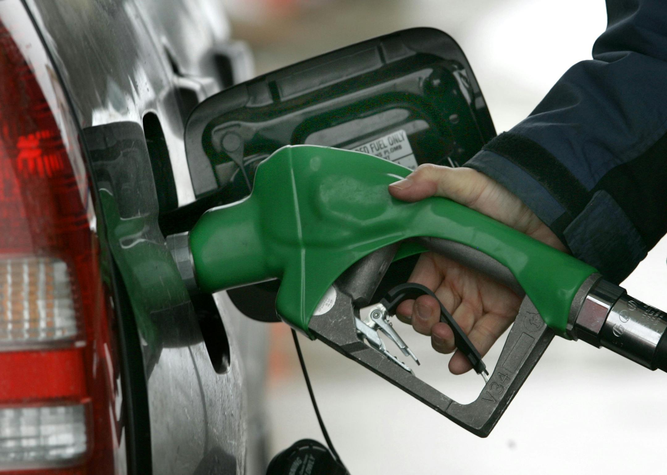 A customer pumps gasoline into her car at the BP station in Bainbridge Twp., Ohio on Monday, March 10, 2008. Oil prices surged Monday above $108 to a new inflation-adjusted record and their fifth new high in the last six sessions on an upbeat report on wholesale inventories. (AP Photo/Amy Sancetta) ORG XMIT: OHAS102 ORG XMIT: MIN2017010313214026