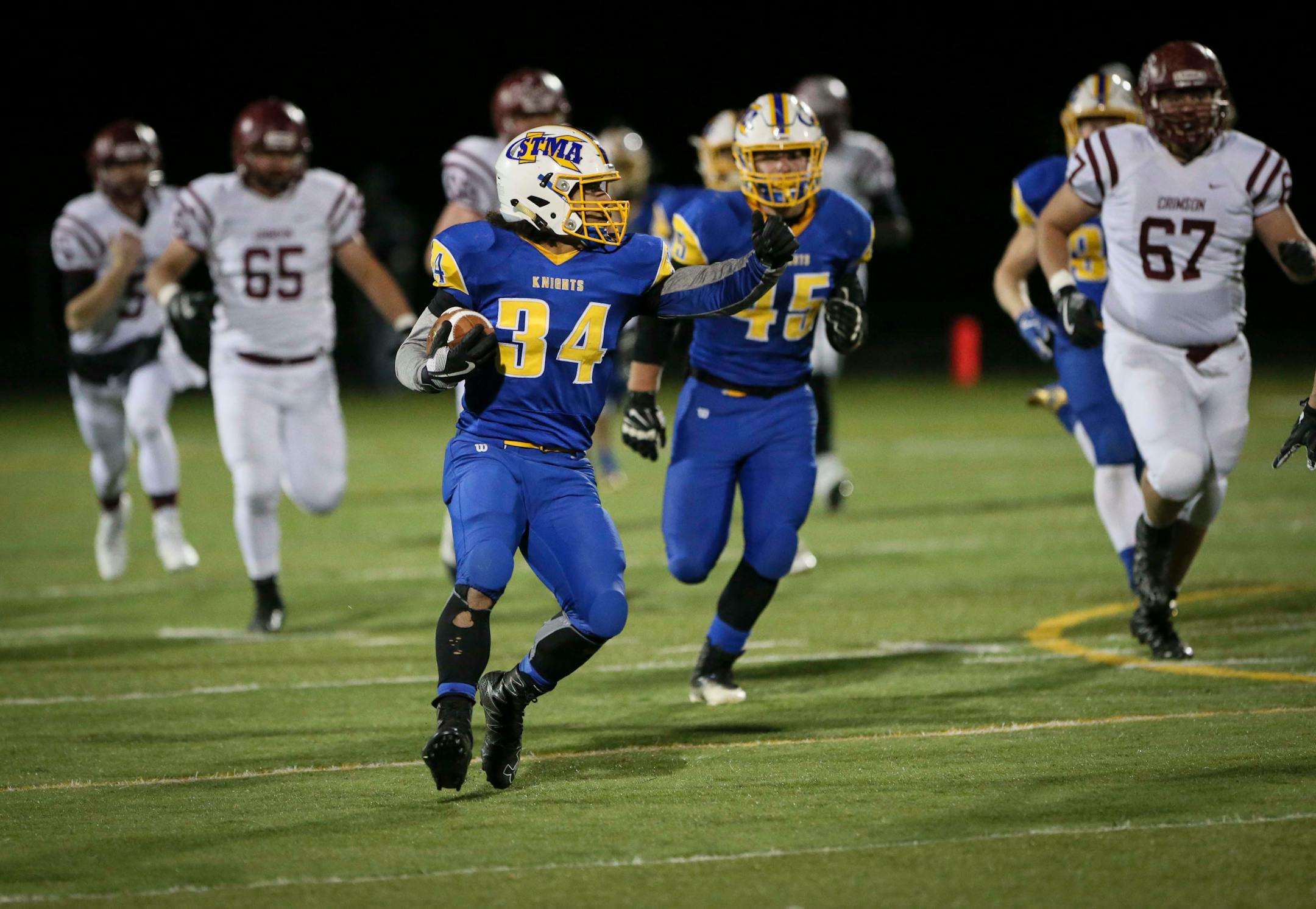 St. Michael-Albertville's Austin Bucholz (34) ran with an interception in the second period. ] RENEE JONES SCHNEIDER ï renee.jones@startribune.com Class 6A quarterfinals between St. Michael-Albertville and Maple Grove on Thursday, November 9, 2017, in Brooklyn Park, Minn.