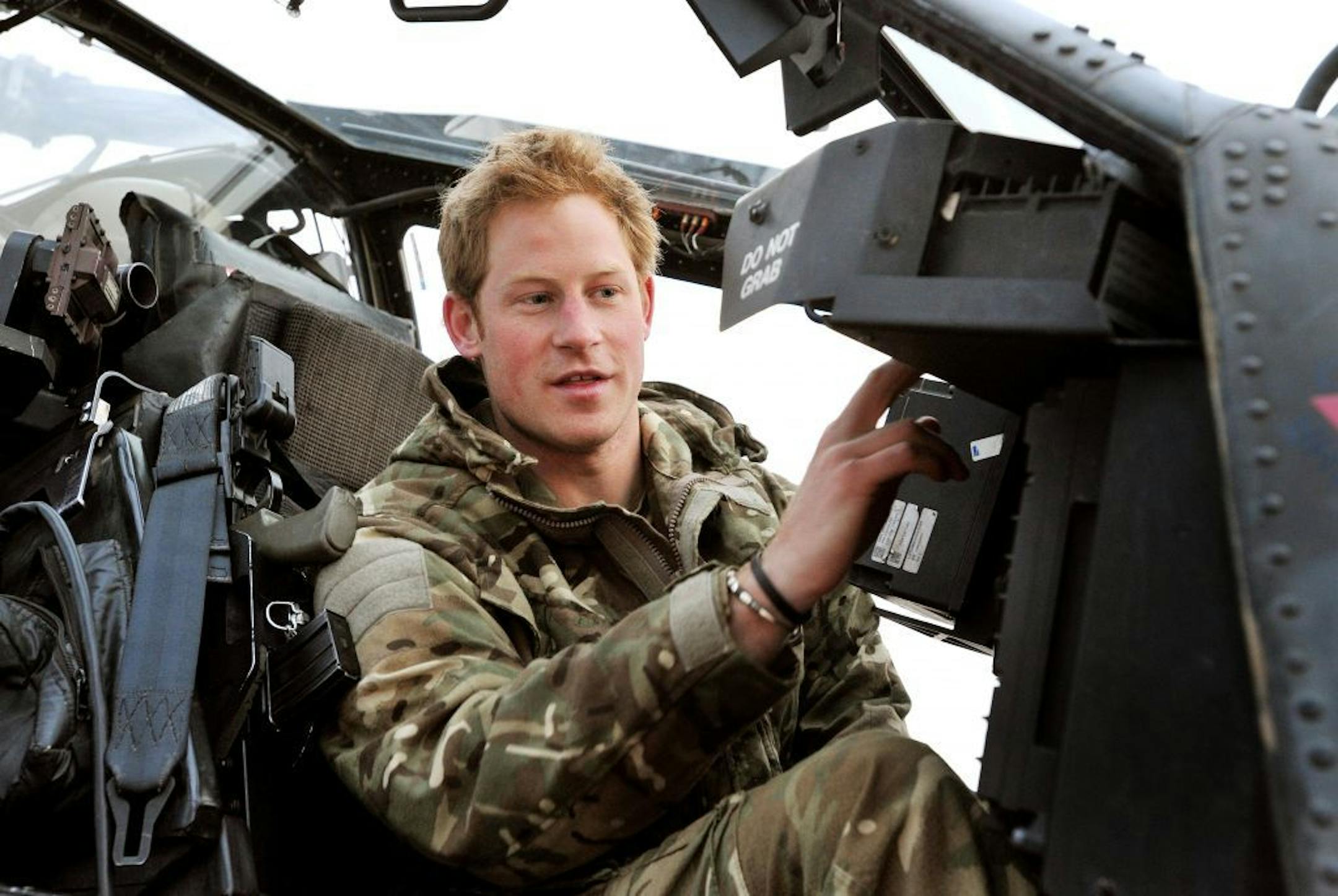 In this photo taken Dec. 12, 2012, made available Monday Jan. 21, 2013 of Britain's Prince Harry or just plain Captain Wales as he is known in the British Army, makes his early morning pre-flight checks on the flight-line, from Camp Bastion southern Afghanistan. The Ministry of Defense announced Monday that the 28-year-old prince is returning from a 20-week deployment in Afghanistan, where he served as an Apache helicopter pilot with the Army Air Corps.