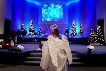 "Special Angel," Andy Hofer, who had the only speaking part, made his way to the stage so he could learn his part, before the pageant performance at M