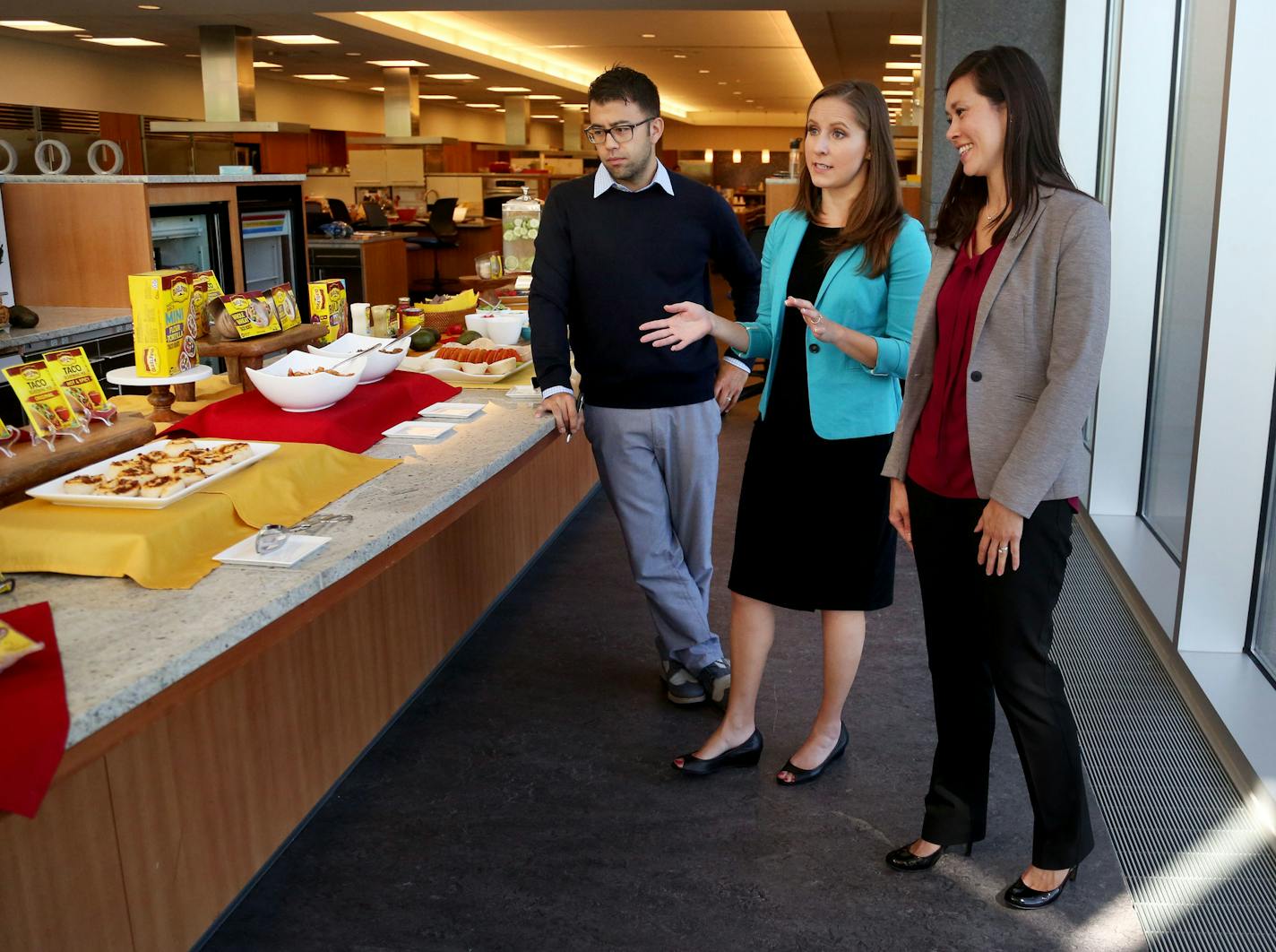 Brad Hiranaga, director of marketing for General Mills&#xed; Old El Paso, left to right, Michelle La Berge, senior marketing manager for General Mills&#xed; Old El Paso and Alyssa Buckalew, research and development manager for General Mills&#xed; Old El Paso, seen in General Mills' Betty Crocker Kitchen Wednesday, Aug. 31, 2016, in Golden Valley, MN.](DAVID JOLES/STARTRIBUNE)djoles@startribune Old El Paso taco shells and Mexican food items may not be what comes to mind when thinking about high-g