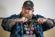 Mike Sharp shows how to handle a gun safely in Sharpe caters to a growing group of gun owners — urban liberals, many of whom identify as women, LGBT