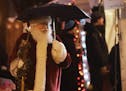 Holidazzle kicked off at Friday, Nov. 23, 2018, at Loring Park in Minneapolis, MN. Here, Santa sported an umbrella while briefly strolling the Holidaz