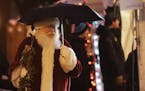 Holidazzle kicked off at Friday, Nov. 23, 2018, at Loring Park in Minneapolis, MN. Here, Santa sported an umbrella while briefly strolling the Holidaz