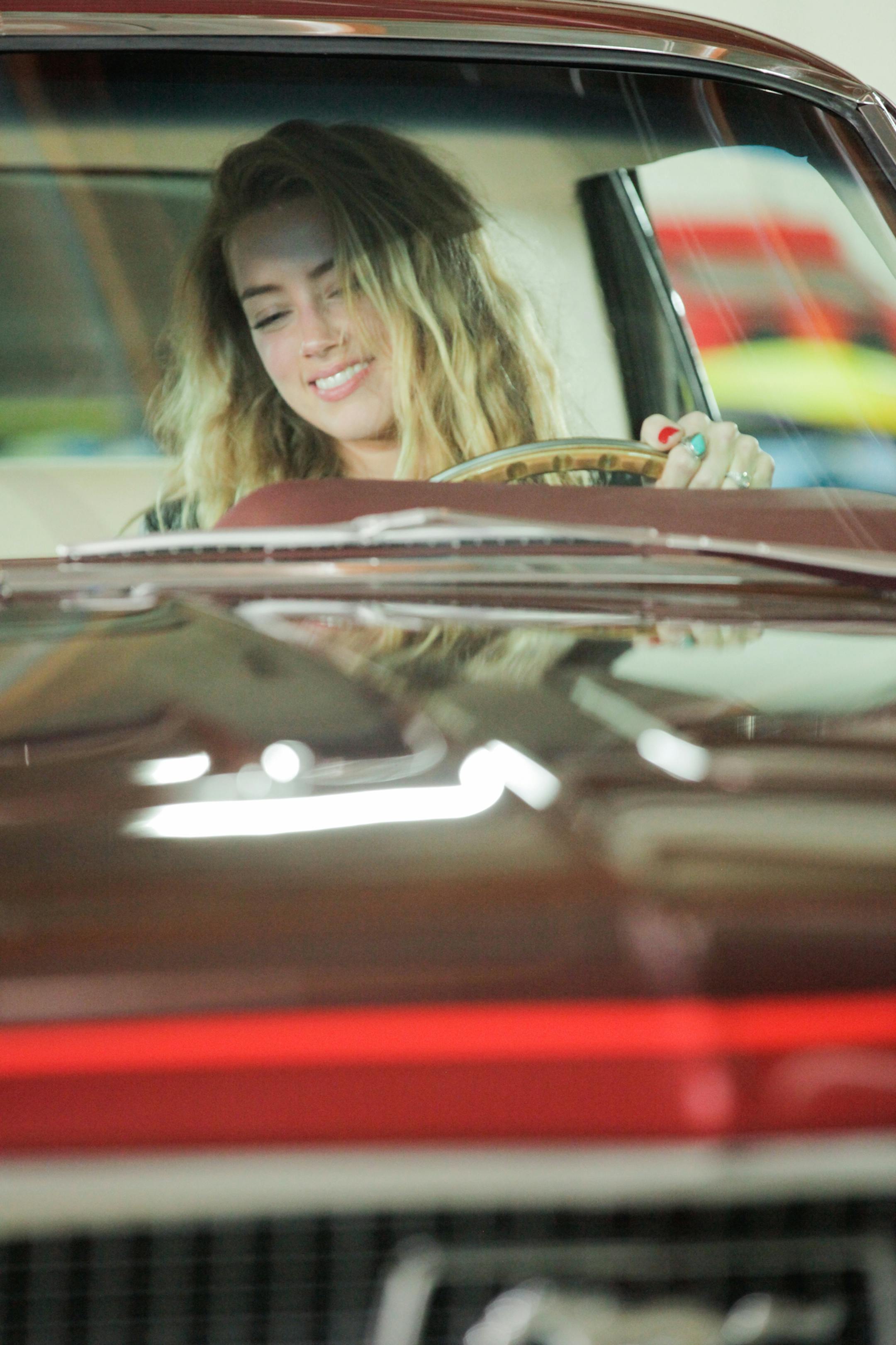 Amber Heard is happy to be behind the wheel of her overhauled 1968 Mustang Coupe on "Overhaulin' " Velocity ORG XMIT: Producer Deliverable