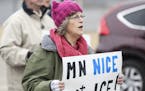 Melody Luetke held a sign that read "MN nice...not ICE!" during a protest march from the Fort Snelling Light Rail station to the Bishop Henry Whipple 