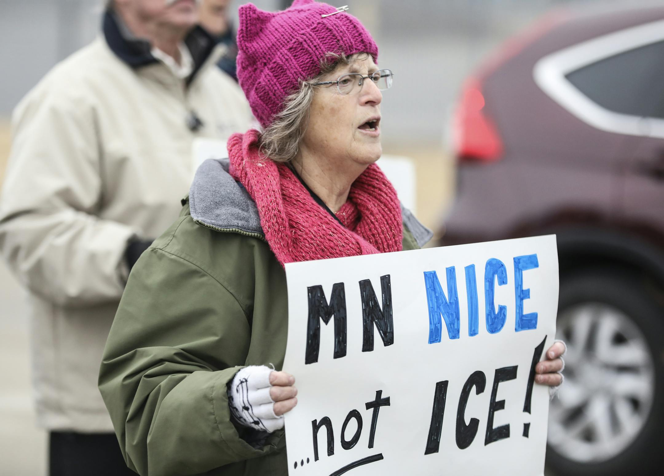 Melody Luetke held a sign that read "MN nice...not ICE!" during a protest march from the Fort Snelling Light Rail station to the Bishop Henry Whipple Federal Building in Minneapolis, Minn., on March 24, 2017. ] RENEE JONES SCHNEIDER • renee.jones@startribune.com