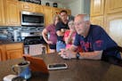 From his home in Pipestone, retired U.S. Army Maj. Robert Douty, along with his family, talks with his son U.S. Army Lt. Col. Brian Douty, who is curr