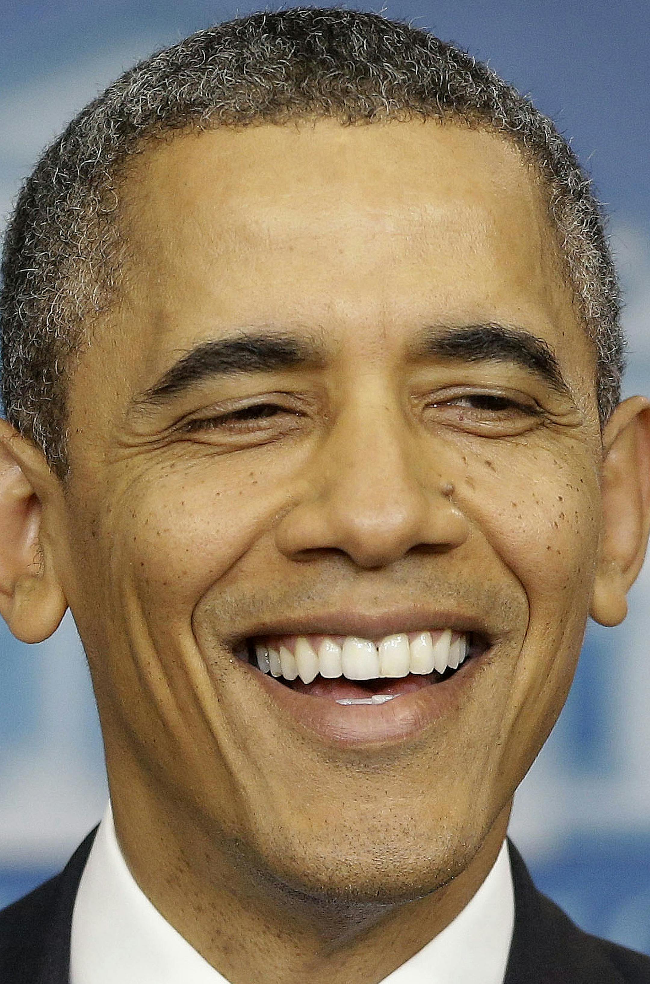 President Barack Obama smiles as he prepares to answer a question during an end-of-the year news conference in the Brady Press Briefing Room at the White House in Washington, Friday, Dec. 20, 2013. At the end of his fifth year in office, Obama's job approval and personal favorability ratings have fallen to around the lowest point of his presidency. Obama will depart later for his home state of Hawaii for his annual Christmas vacation trip. It's the first time in his presidency that his departure