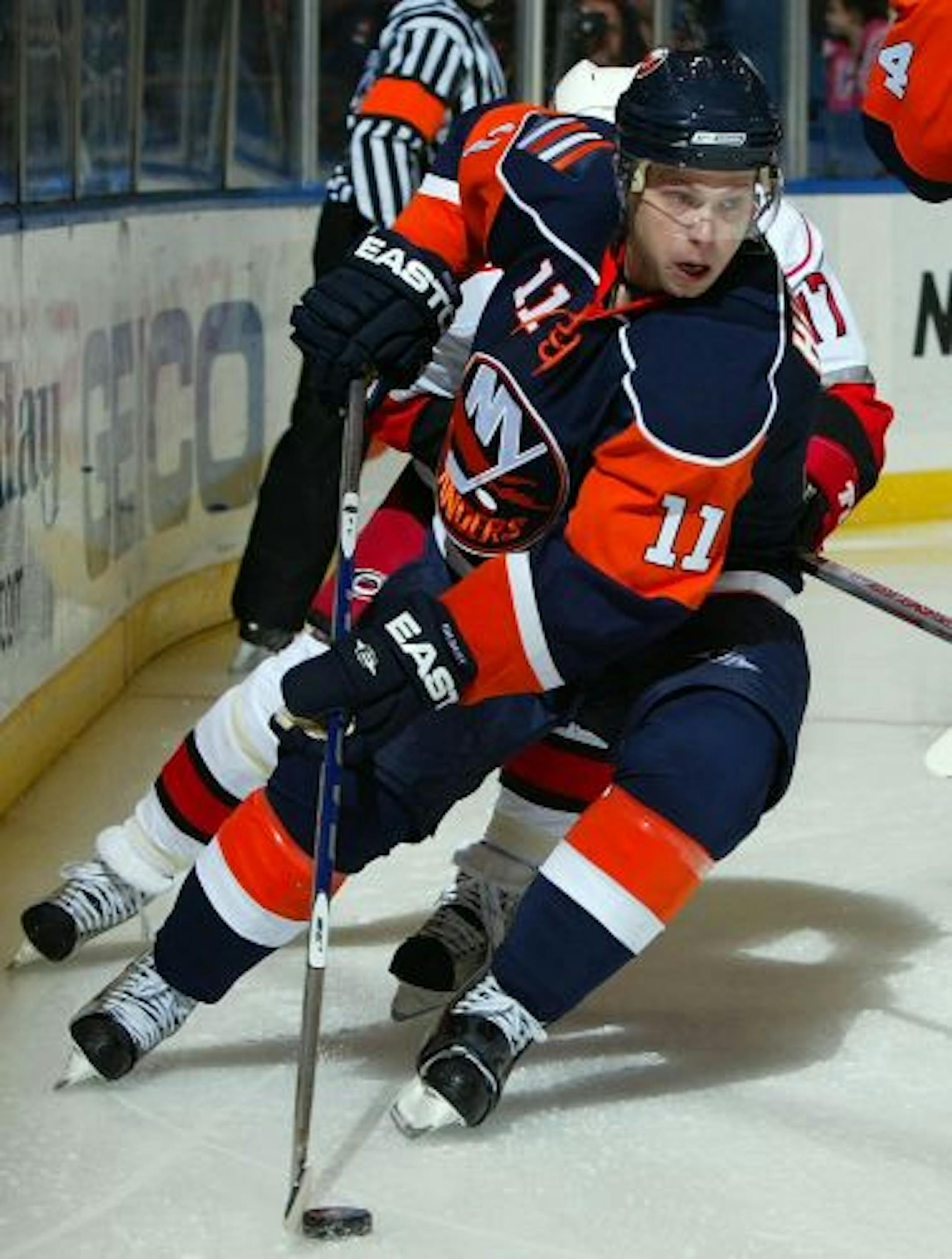 UNIONDALE, NY - FEBRUARY 19: Andy Hilbert #11 of the New York Islanders skates against the Carolina Hurricanes on February 19, 2009 at Nassau Coliseum in Uniondale, New York. The Hurricanes defeated the Isles 6-2.