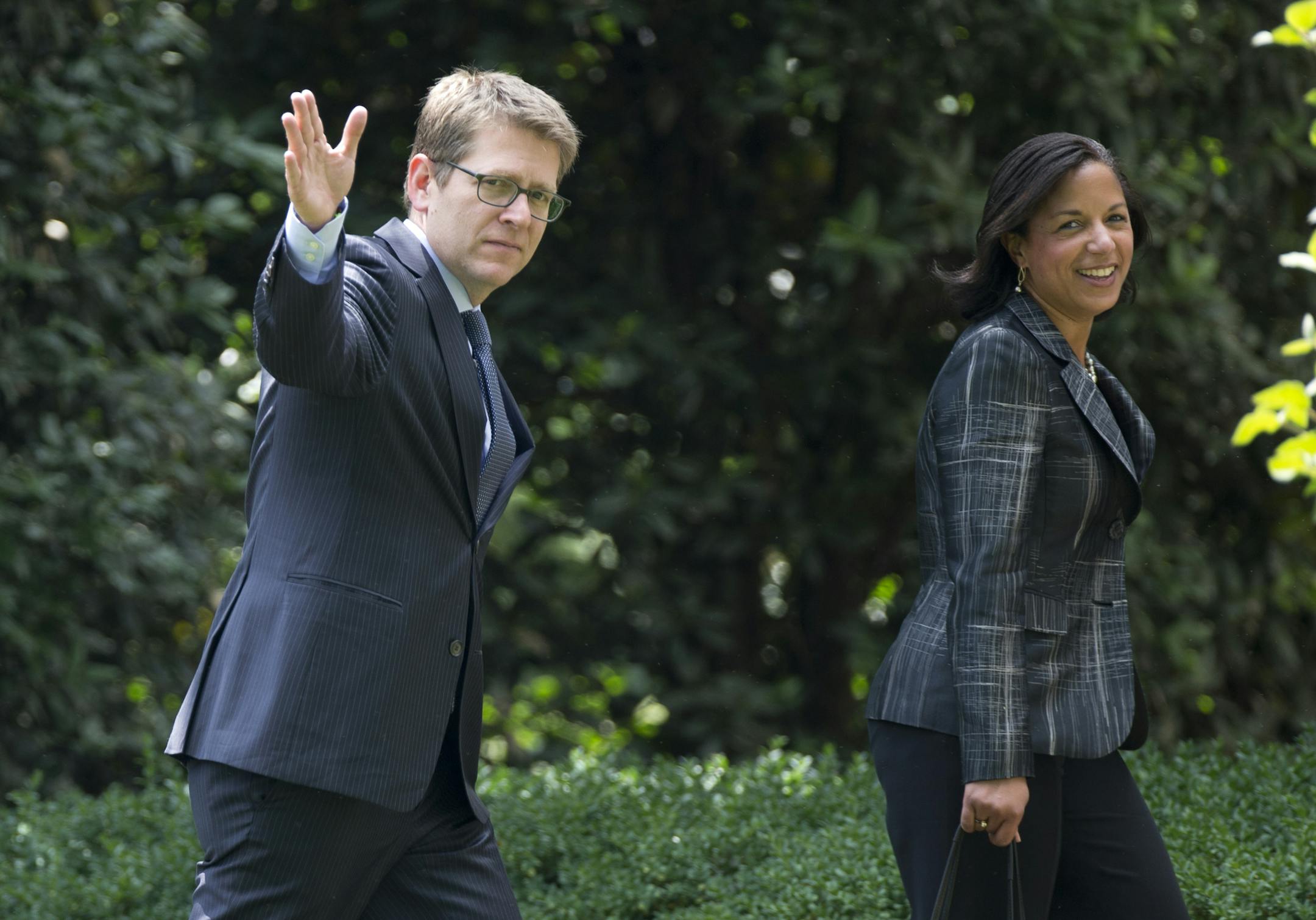 National Security Adviser Susan Rice, left, and White House press secretary Jay Carney walk from Marine one to the White House, in Washington, Wednesday, May 28, 2014, as they return with President Barack Obama where he delivered the commencement address at the United States Military Academy at West Point, New York. (AP Photo/Carolyn Kaster)