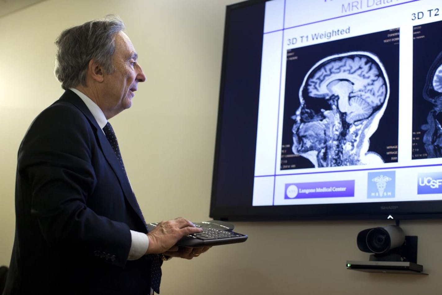 Dr. Charles Marmar, the chairman of the psychiatry department at NYU Langone Medical Center who is leading a study on post-taumatic stress disorder, with brain scans from study participants in New York, Jan. 30, 2013. A team of researchers based out of New York University's medical school have begun a five-year study to find biological signals that could provide reliable, objective evidence of so-called invisible injuries of war.