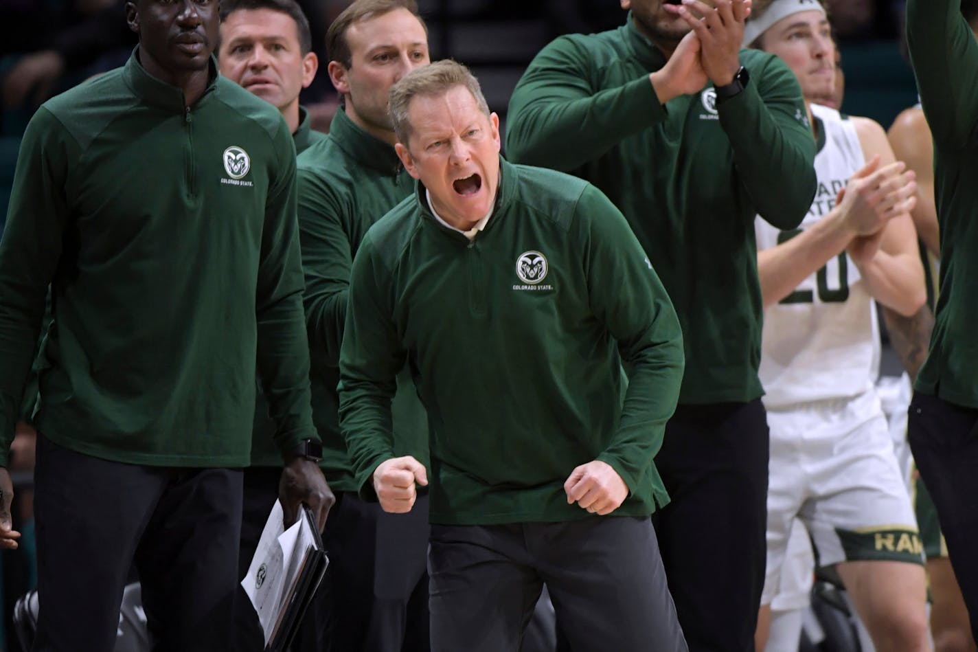 Colorado State coach Niko Medved cheers during the second half of the team's NCAA college basketball game against Washington, Saturday, Dec. 2, 2023, in Las Vegas. (AP Photo/Sam Morris)