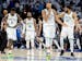 Anthony Edwards (5), Mike Conley (10), Rudy Gobert (27) and Karl-Anthony Towns (32) of the Timberwolves walk off the court at the end of Game 1 of the