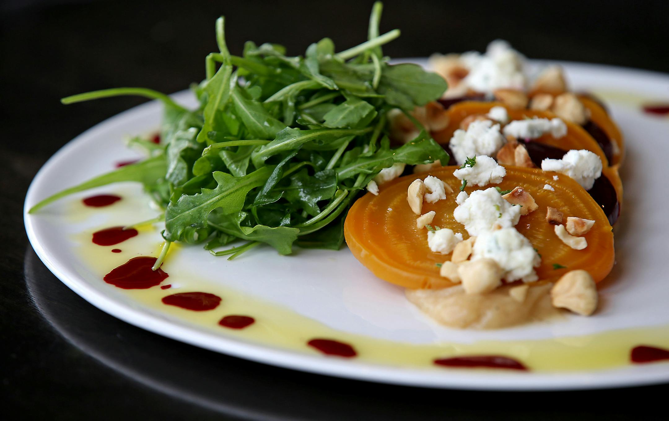 Beet roasted salad and marinated beets, brown butter vinaigrette, toasted hazelnuts, wild arugula, and truffled local goat cheese at Vivo, Monday, February 16, 2015 in Apple Valley, MN. ] (ELIZABETH FLORES/STAR TRIBUNE) ELIZABETH FLORES &#x2022; eflores@startribune.com ORG XMIT: MIN1502161426280608