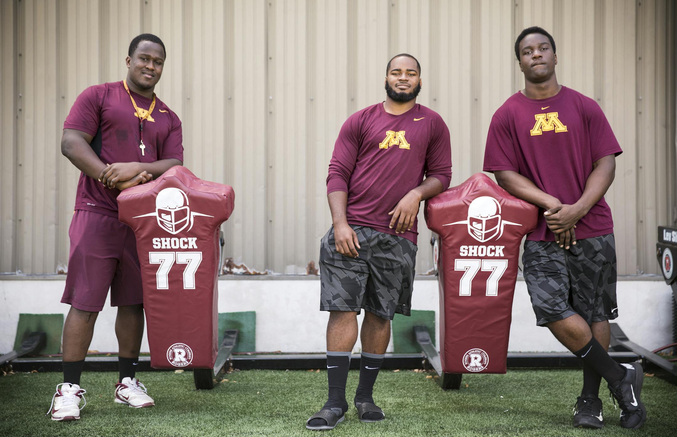 Gophers football players Scott Ekpe, from left, Rodrick Williams, Jr. and Hendrick Ekpe, who all played in high school together in Lewisville, Texas, photographed at the Gibson-Nagurski Football Facility at University of Minnesota in Minneapolis on Tuesday, August 4, 2015. ] LEILA NAVIDI leila.navidi@startribune.com /