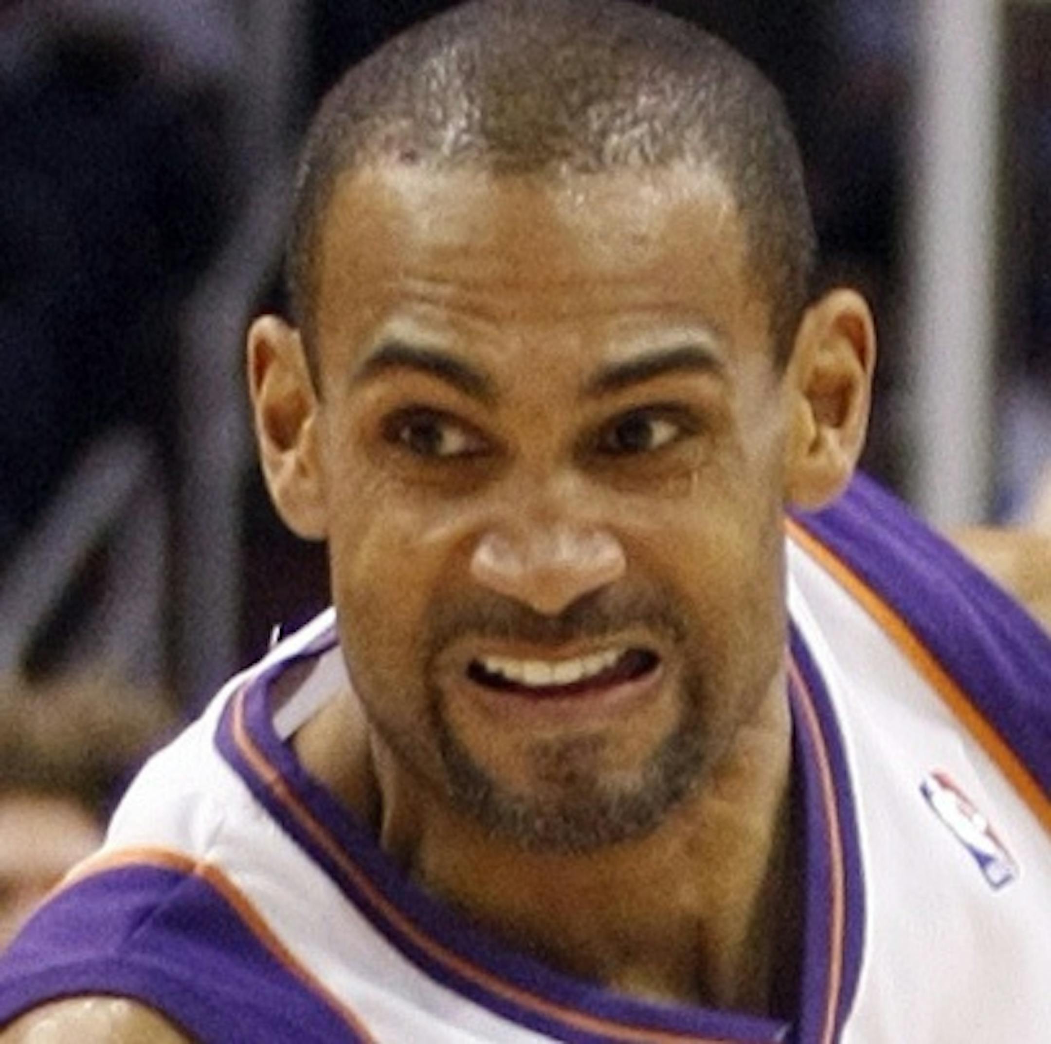 Los Angeles Clippers' Eric Gordon, left, strips the ball from Phoenix Suns' Grant Hill during the first quarter of an NBA basketball game on Friday, Feb. 26, 2010, in Phoenix. (AP Photo/Rick Scuteri)