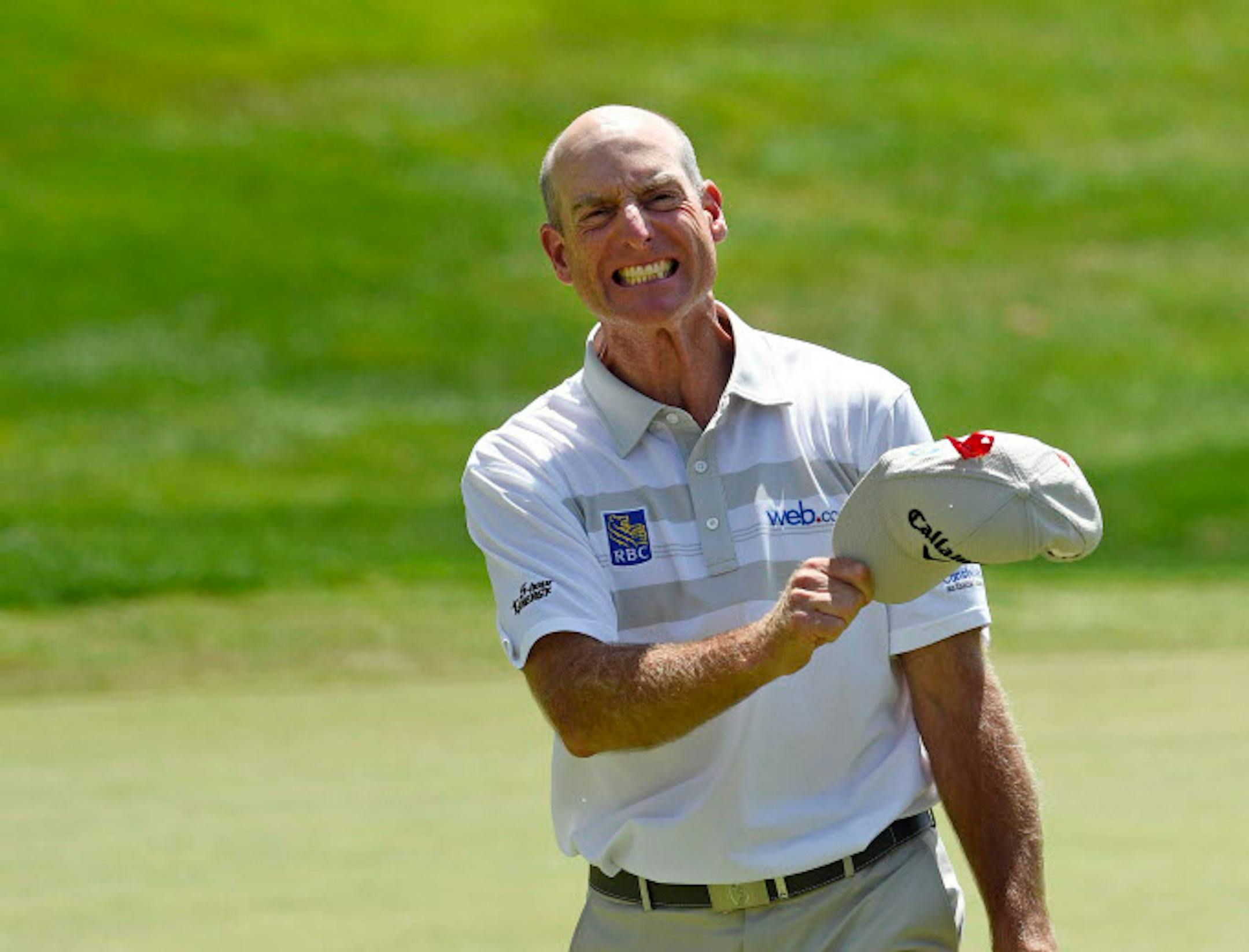 Jim Furyk celebrates after shooting a course and PGA-record 58 during the final round of the Travelers Championship golf tournament in Cromwell, Conn., Sunday, Aug. 7, 2016. (AP Photo/Fred Beckham)