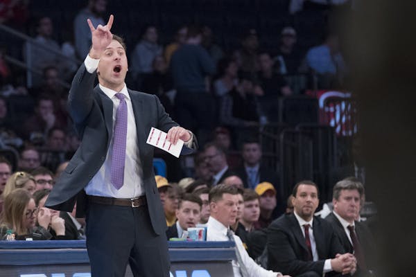 Minnesota head coach Richard Pitino gestures during the first half of an NCAA college basketball game against Ohio State, Saturday, Jan. 20, 2018, at 