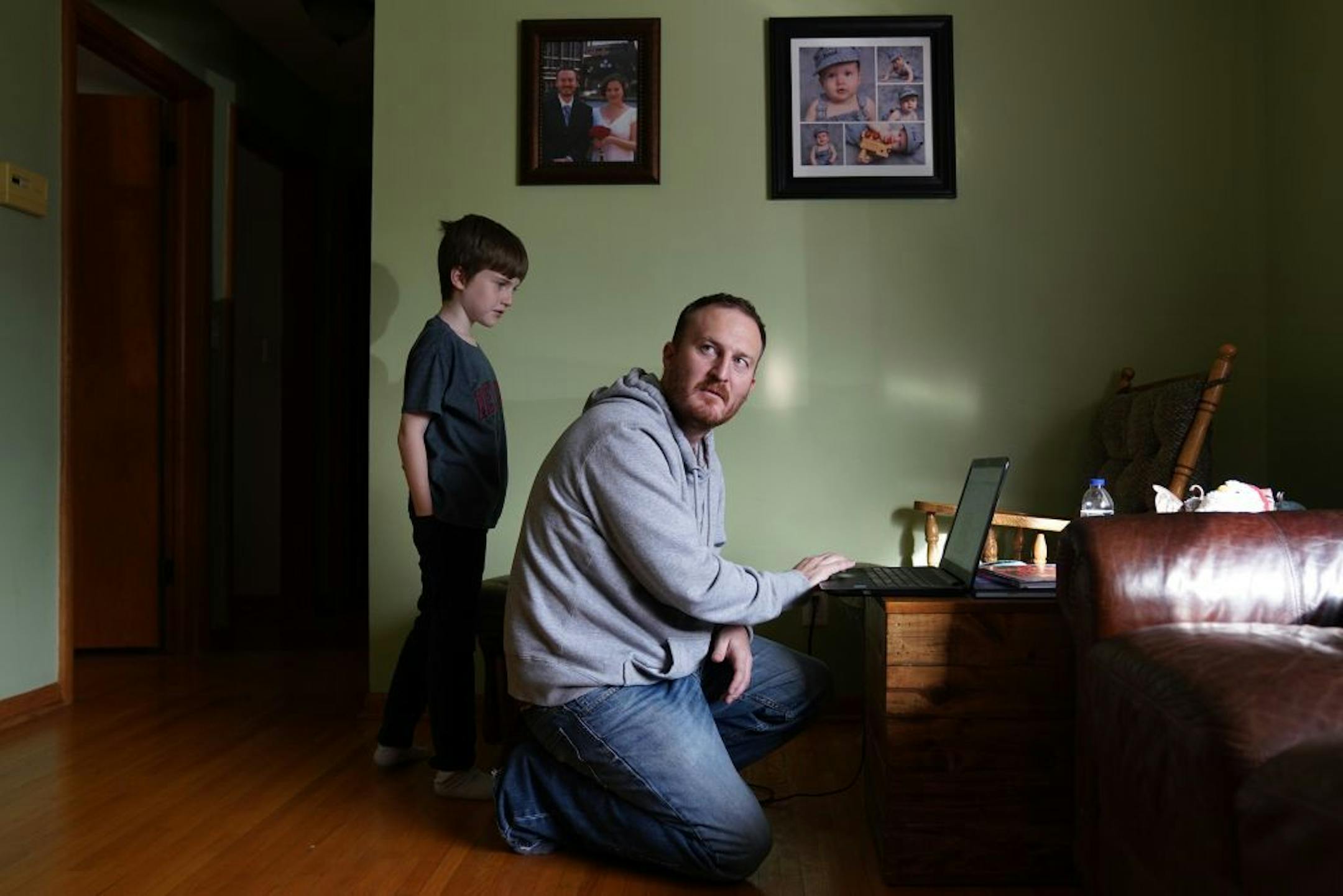 Dan Clapero turned on his computer to make a video call to his wife, Capt. Elizabeth Clapero, deployed in Kuwait since July.