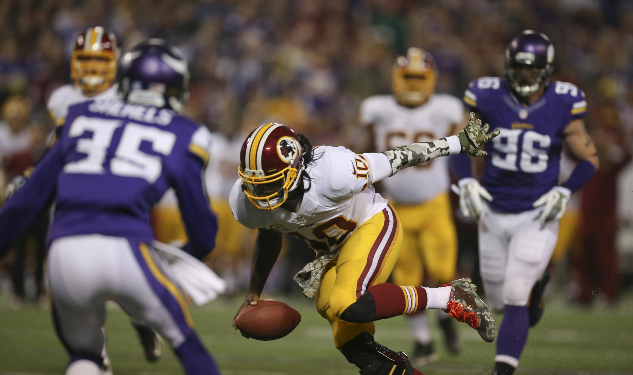 The MInnesota Vikings met the Washington Redskins in an NFL game Thursday night, November 7, 2013 at Mall of America Field in Minneapolis. Washington Redskins quarterback Robert Griffin III (10) scrambled 12 yards to the Minnesota one yard line to set up a second quarter touchdown Thursday night. ] JEFF WHEELER &#x201a;&#xc4;&#xa2; jeff.wheeler@startribune.com