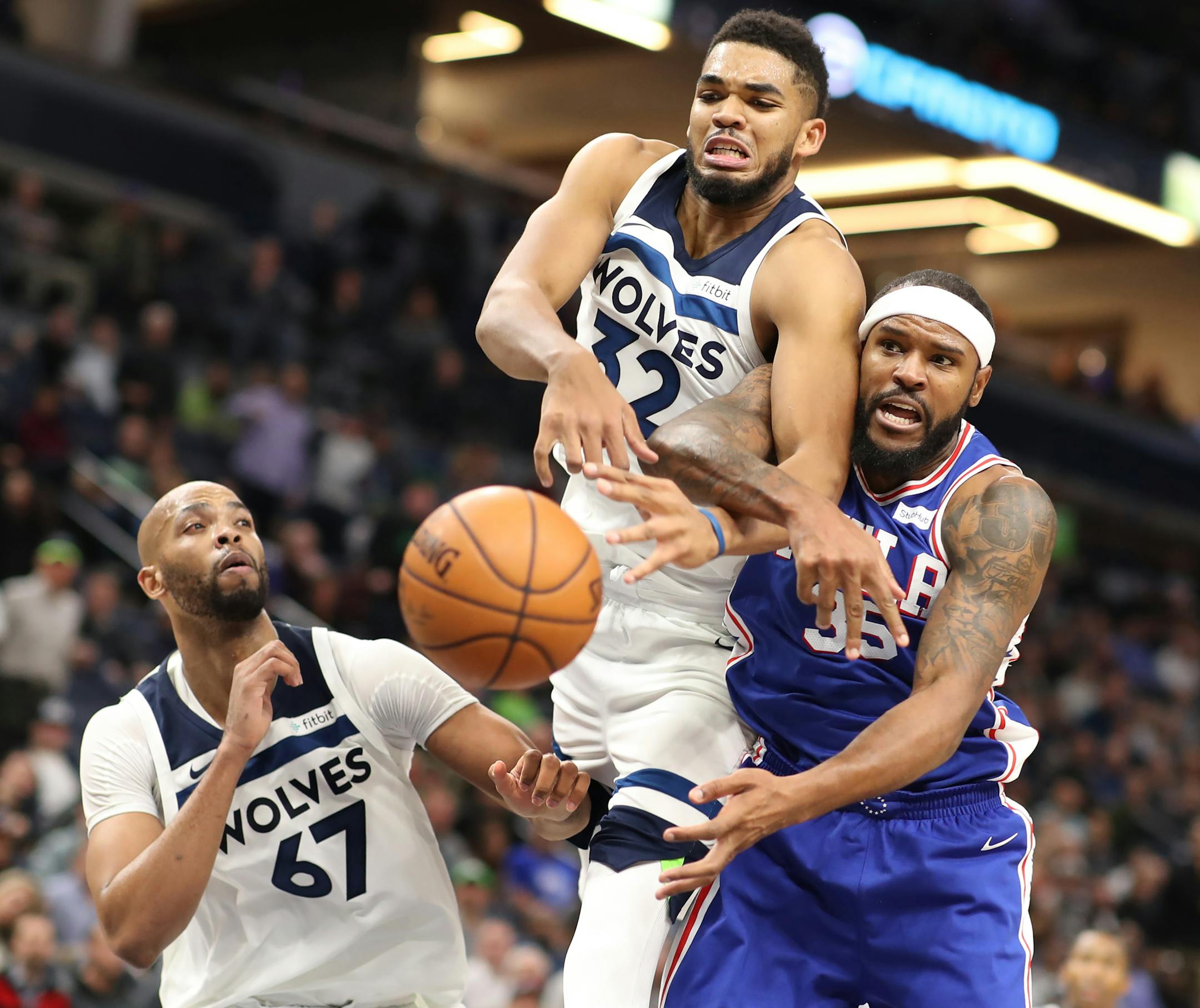 Minnesota Timberwolves center Karl-Anthony Towns (32) knocked the ball out of bounds away from Philadelphia 76ers forward Trevor Booker (35) during second half NBA action at Target Center Tuesday December 12, 2017 in Minneapolis, MN.] The Minnesota Timberwolves hosted the Philadelphia 76ers at Target Center. JERRY HOLT � jerry.holt@startribune.com