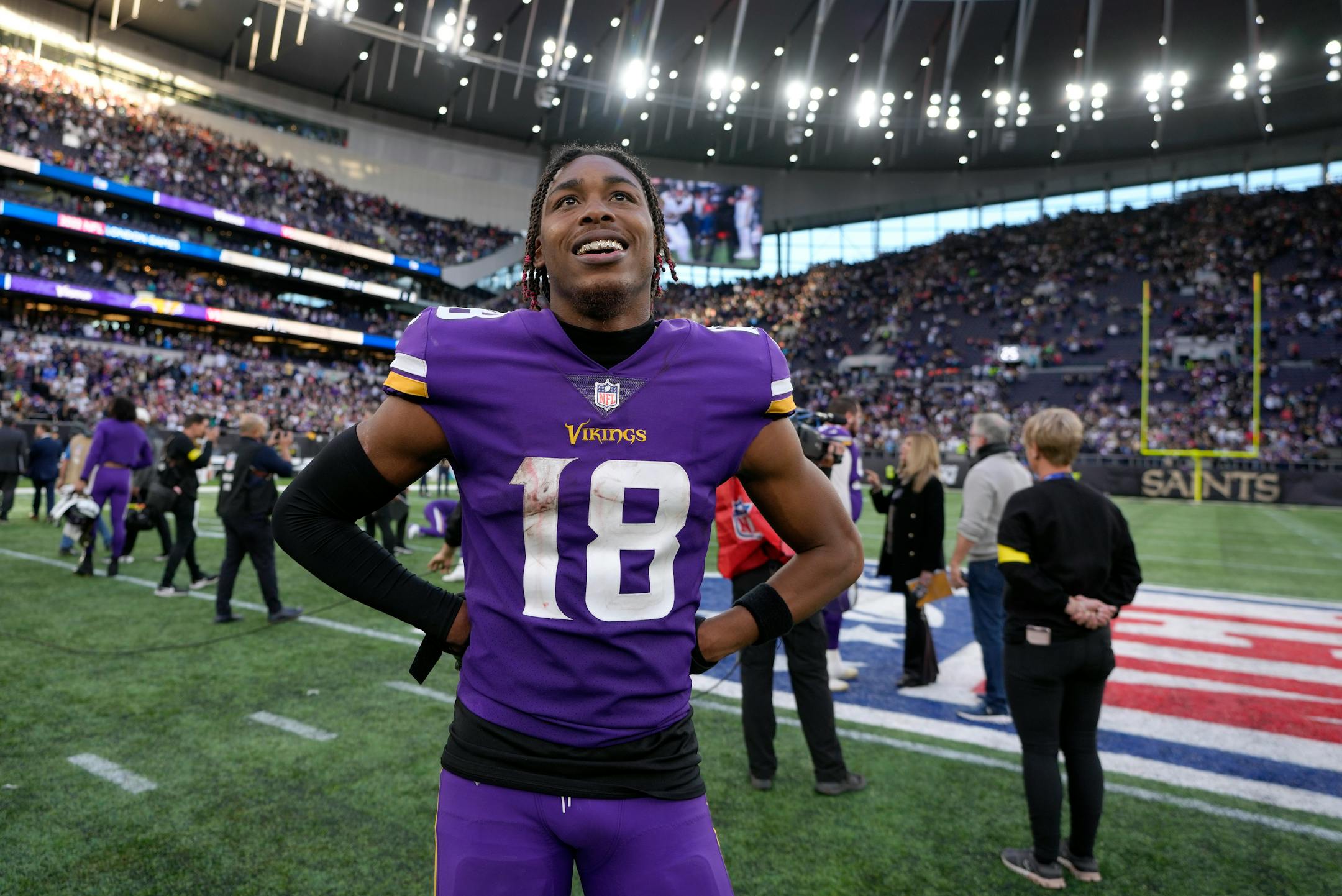 Minnesota Vikings wide receiver Justin Jefferson (18) smiles after winning.