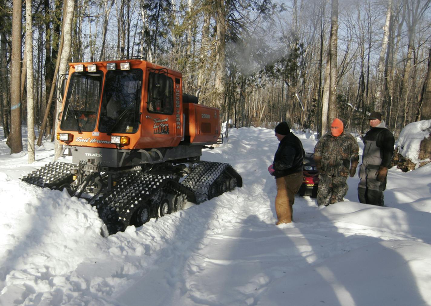 In the tough winter of 2014, members of the McGregor chapter of the Minnesota Deer Hunters Association watched Wayne Bobendrier of the Mamarack Sno Flyers snowmobile club plow a trail in the woods near McGregor where emergency deer feeding occurred. The feeding program used money from deer license fees. This winter has been tough for deer up north, but has not yet reached crisis. ORG XMIT: MIN1403041112460909