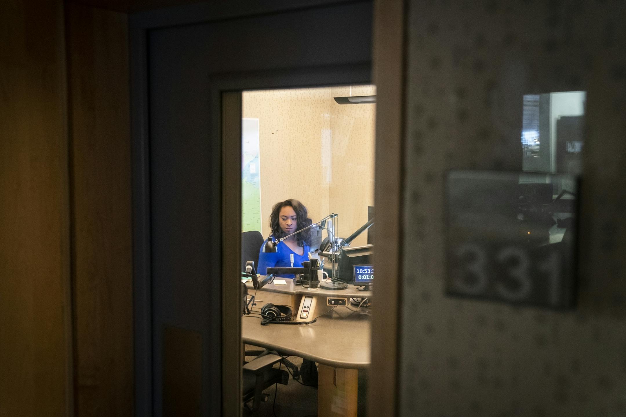 Angela Davis prepares to host her show "MPR News with Angela Davis" inside the MPR studio.